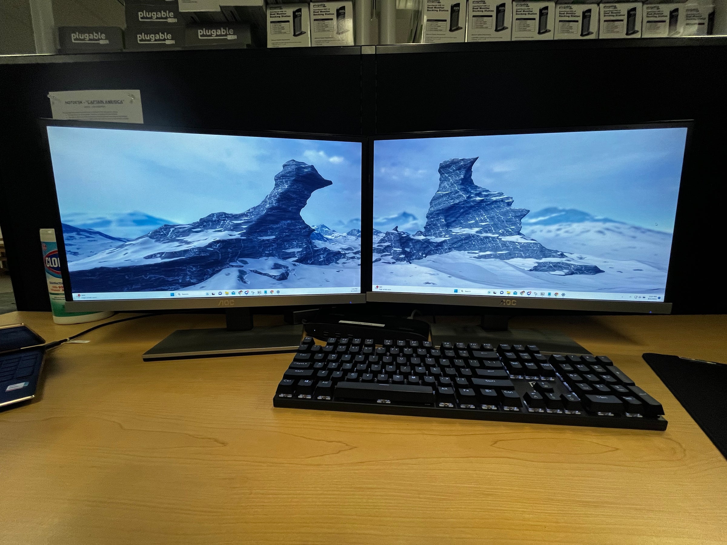 Image of the finished example with the wallpaper spanning across both monitors.