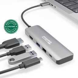 Plugable USBC-4IN1 hub with HDMI, USB-A, and USB-C 10Gbps ports connected to a laptop.