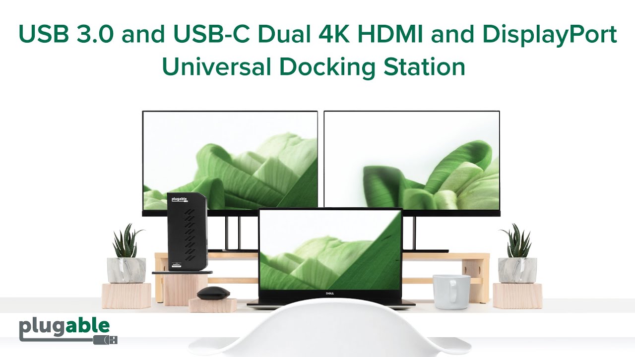 Plugable UD-6950Z docking station on desk connected to a laptop and two monitors
