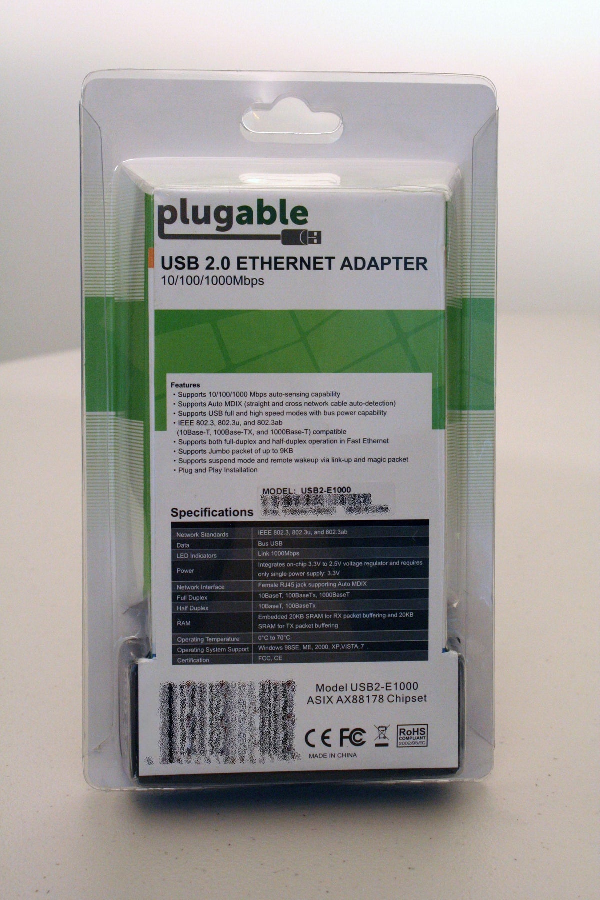 USB2-E1000 packaging showing 10/100/1000Mbps speeds, RJ45 interface, ASIX AX88178 chipset, and Windows OS compatibility.