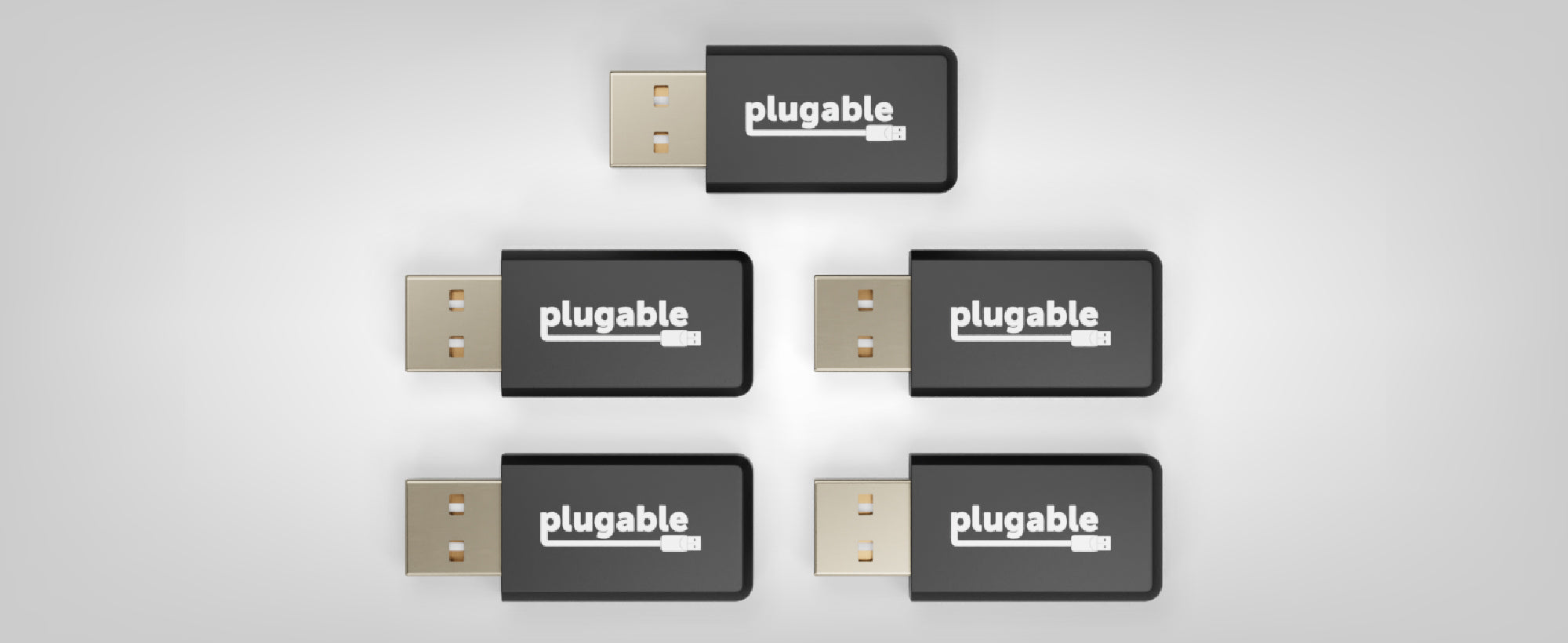 An image of 5 Plugable USB-MC1 adapters.
