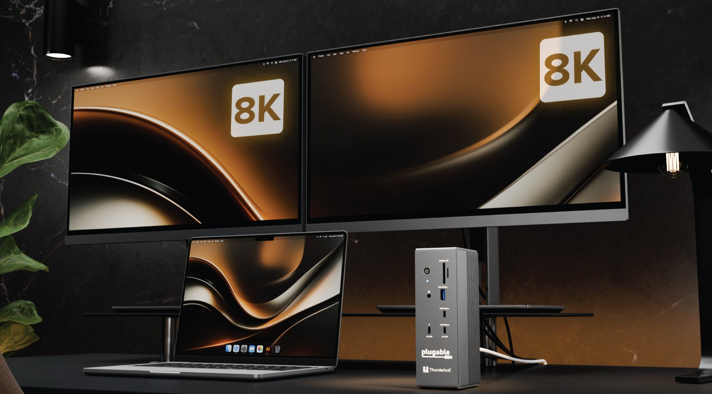 Two 8K monitors with a Thunderbolt dock on a dark surface.