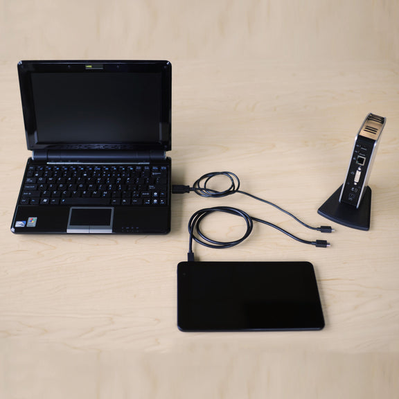 A picture of the Plugable UD-PRO8 Docking Station and a Windows tablet and notebook computer