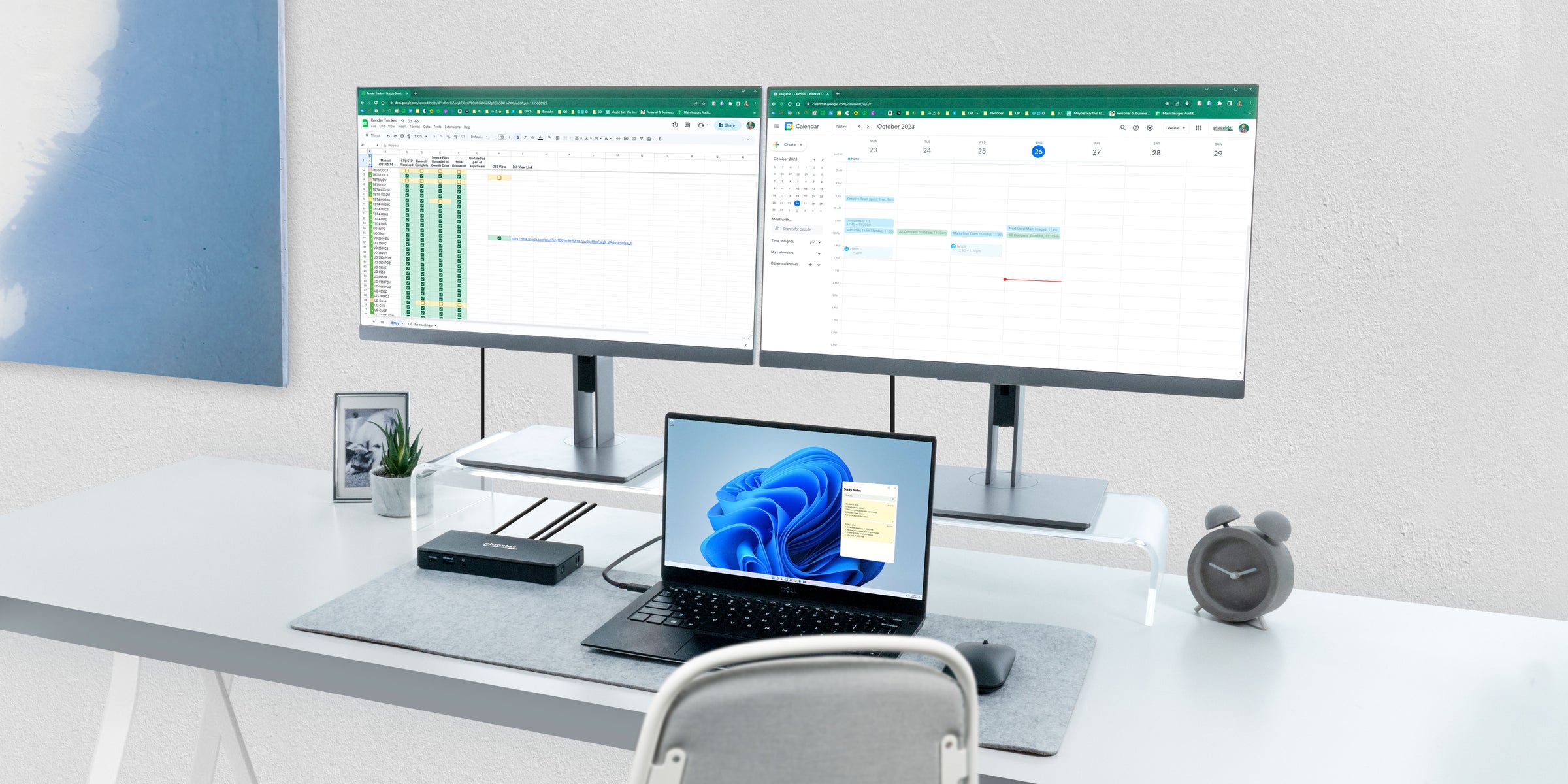 In this image we see an unrealistically clutter-free desk with a dual display docking station. The view is invited to imagine how much more productive they would be with a Plugable dual display docking station. 